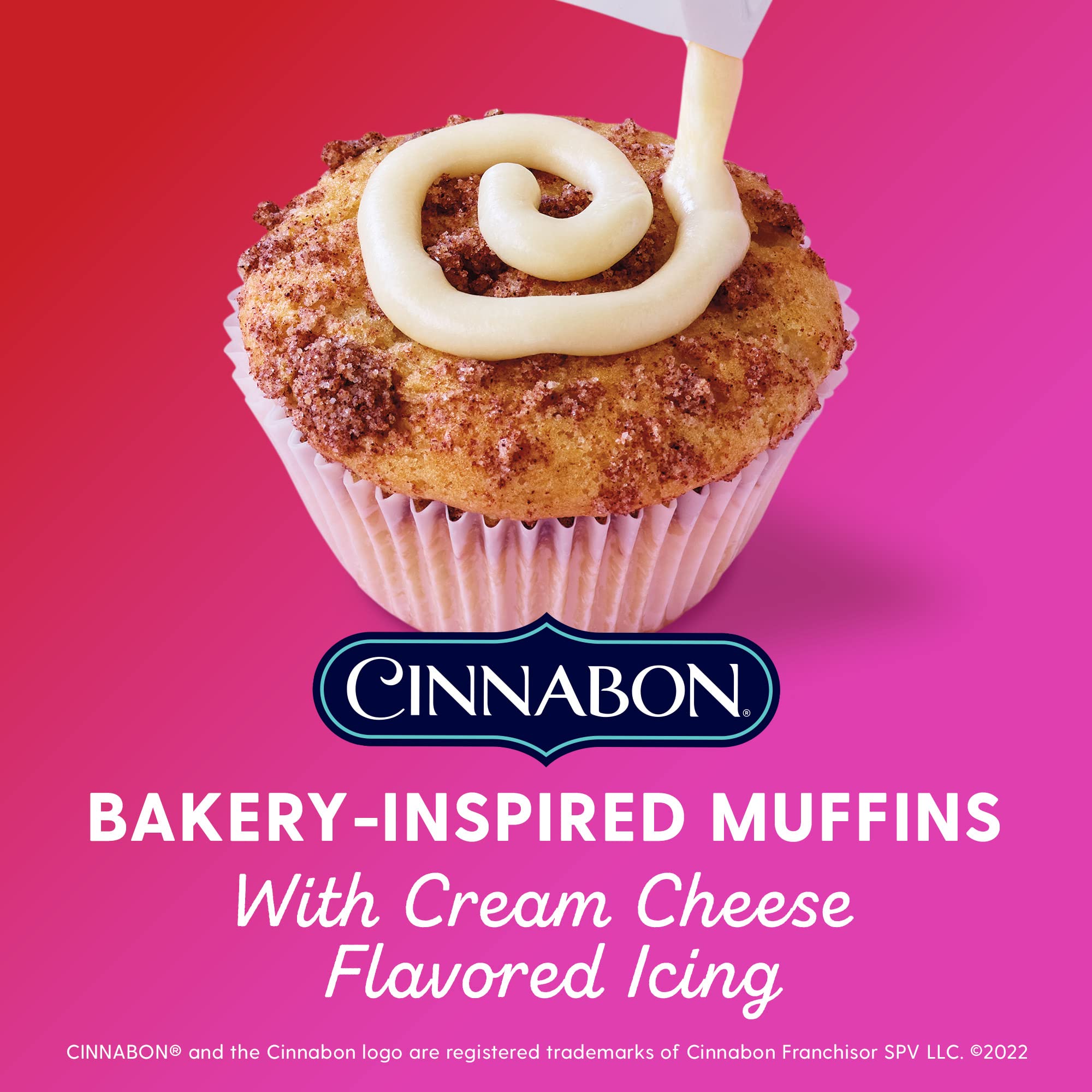 Duncan Hines Epic Cinnabon muffin batter being poured into tins for fluffy results.
