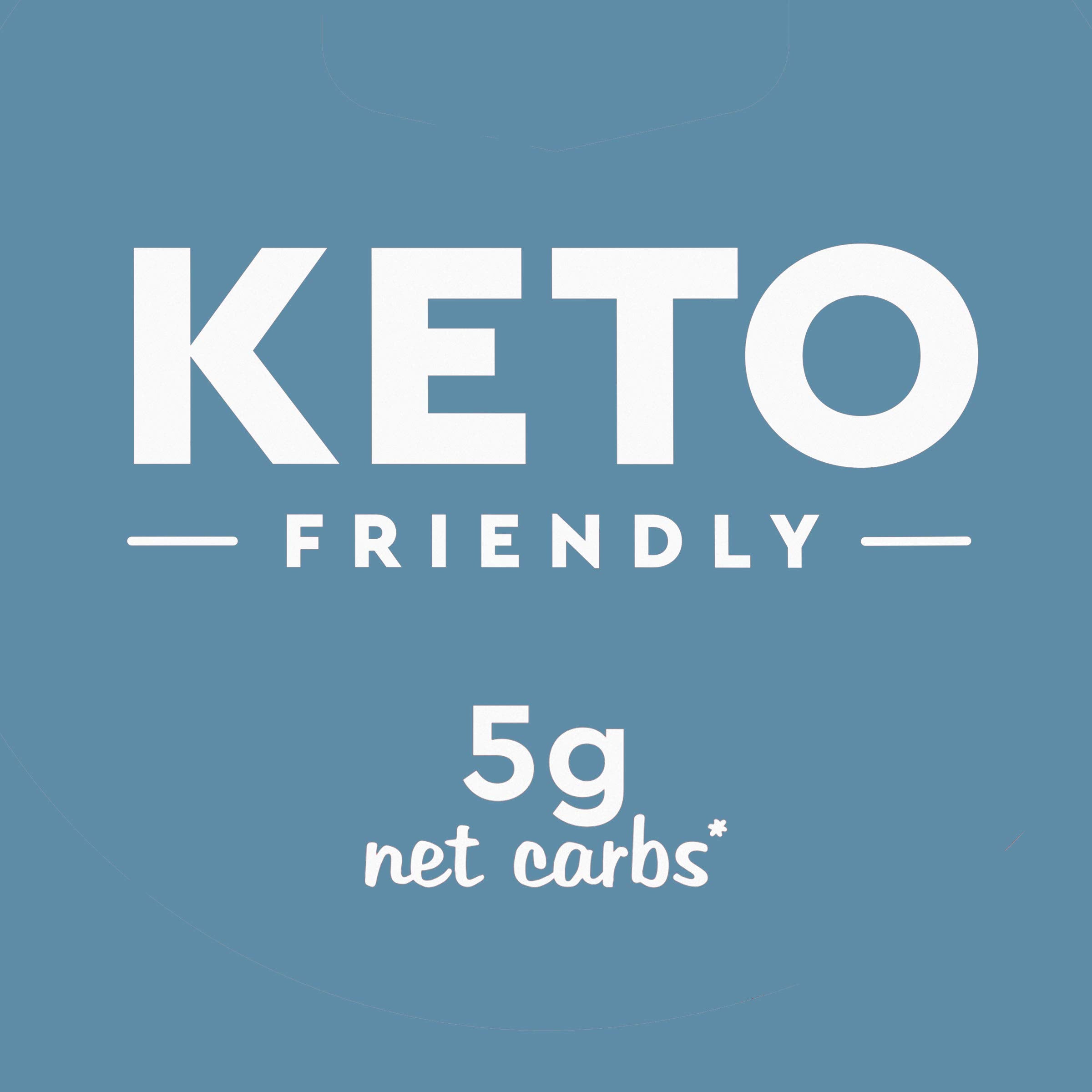Duncan Hines Keto Walnut Fudge Cup on plate beside coffee, ideal snack pairing.