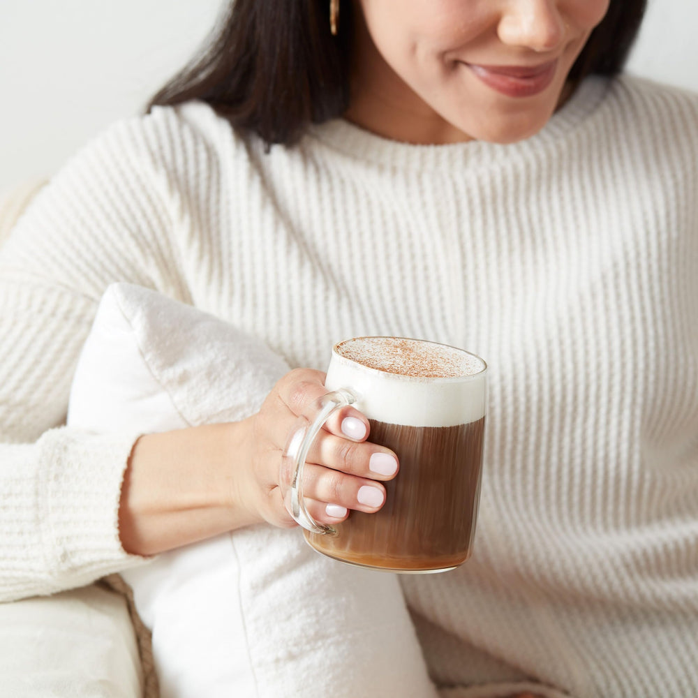 Dunkin Original Blend coffee pouring into cup, inviting fragrant steam.
