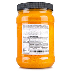 Dutchman’s Popcorn Coconut Oil bottle pouring to coat kernels with buttery flavor and aroma.