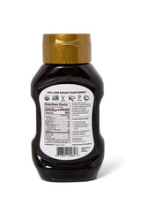 D'Vash Organic Date Syrup being poured for a smooth drizzle on dishes