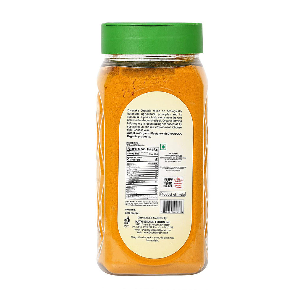 Dwaraka Turmeric Powder ground in a spice bowl, ideal for cooking and Ayurveda-inspired dishes.