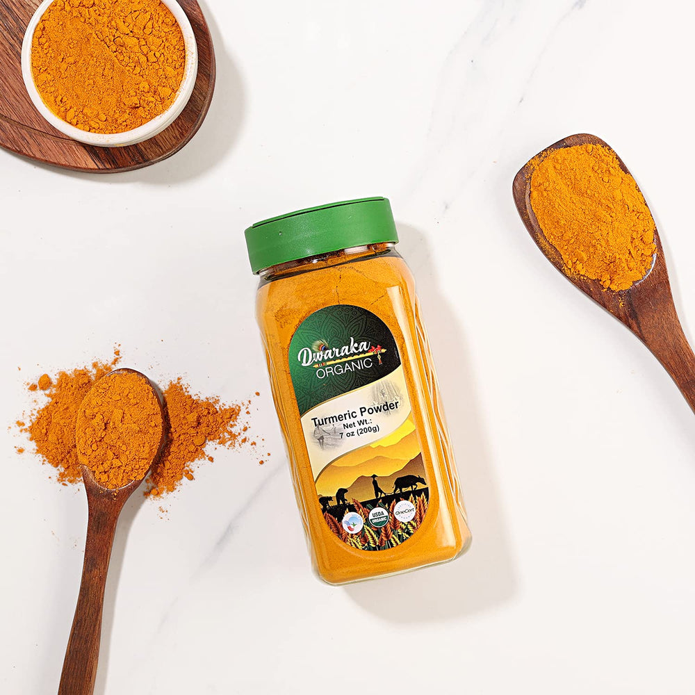 Dwaraka Turmeric Powder jar with scoop for convenient daily use.