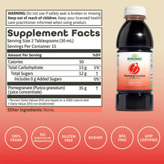 Dynamic Health Pomegranate Juice Concentrate pour showing versatile use in drinks.