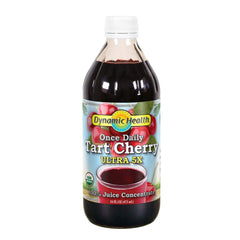 Dynamic Health Tart Cherry Juice Concentrate bottle on kitchen counter, unsweetened and ideal for smoothies.