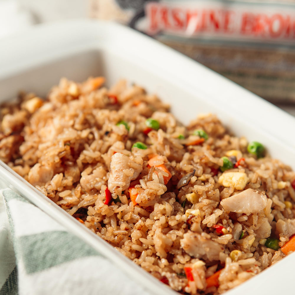 Measuring cup with Dynasty Jasmine Brown Rice highlights portion control