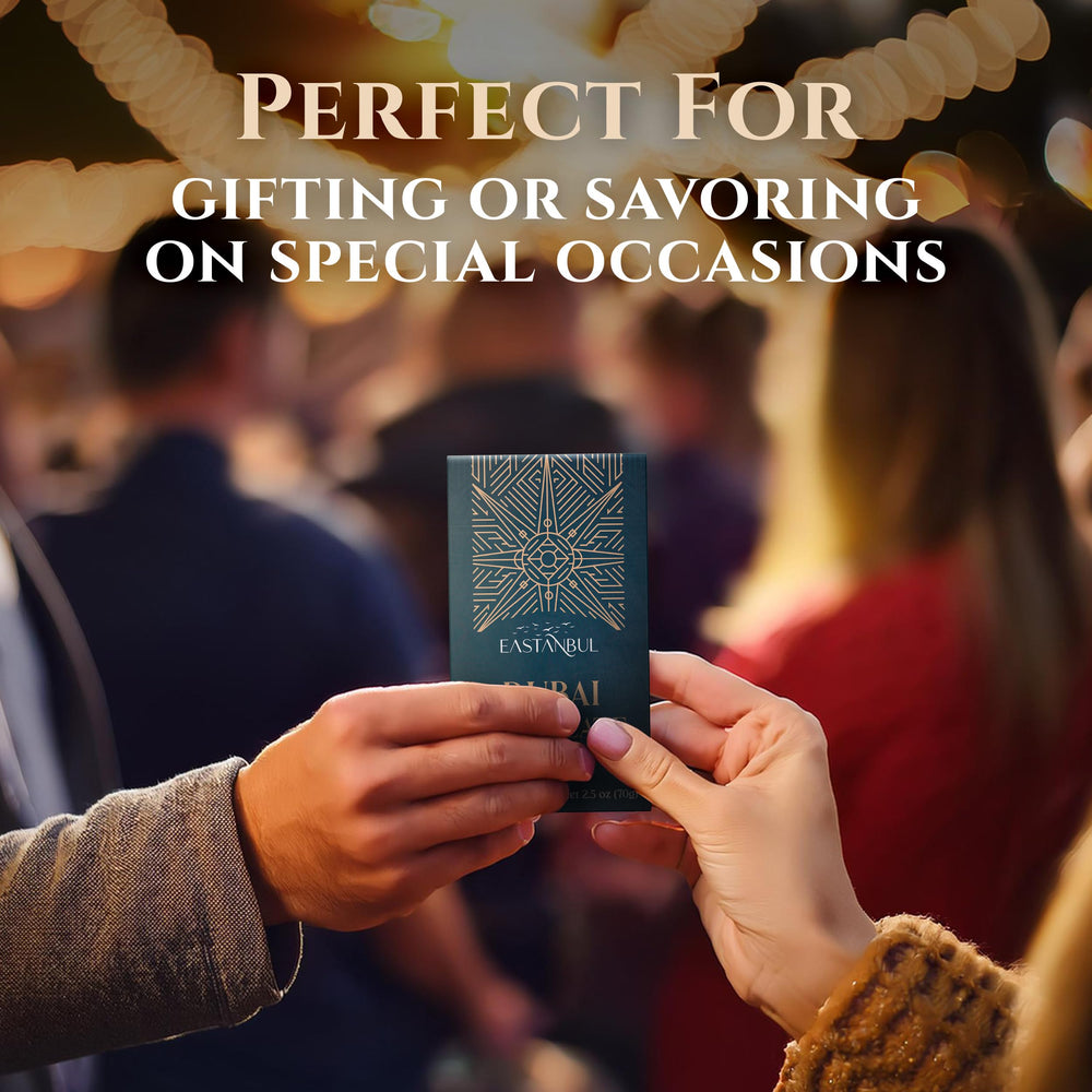 Eastanbul Dubai Pistachio Chocolate Bar in hand suggests shareable luxury moment.