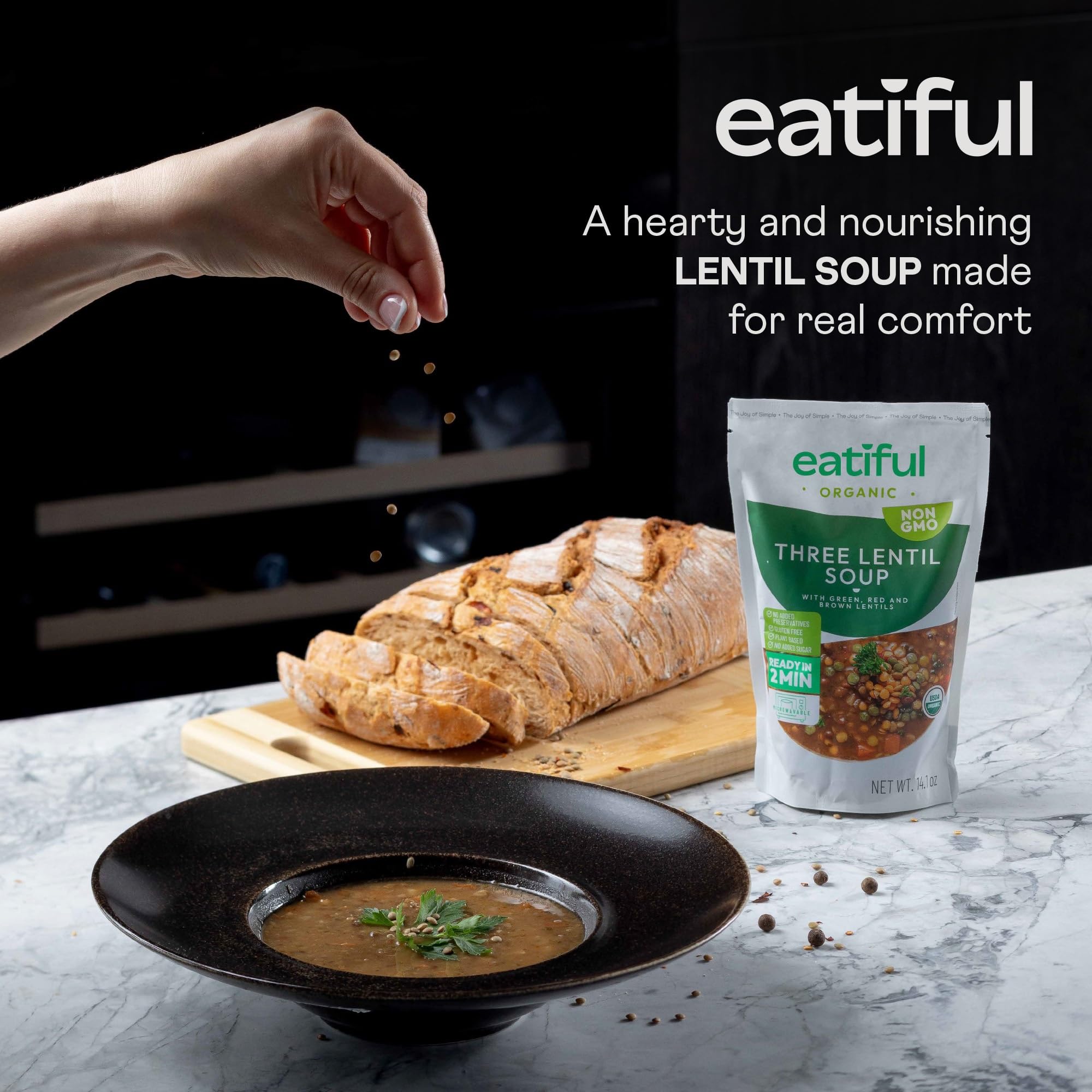 EATIFUL lentil soup served in a bowl, with colorful lentils and vegetables.