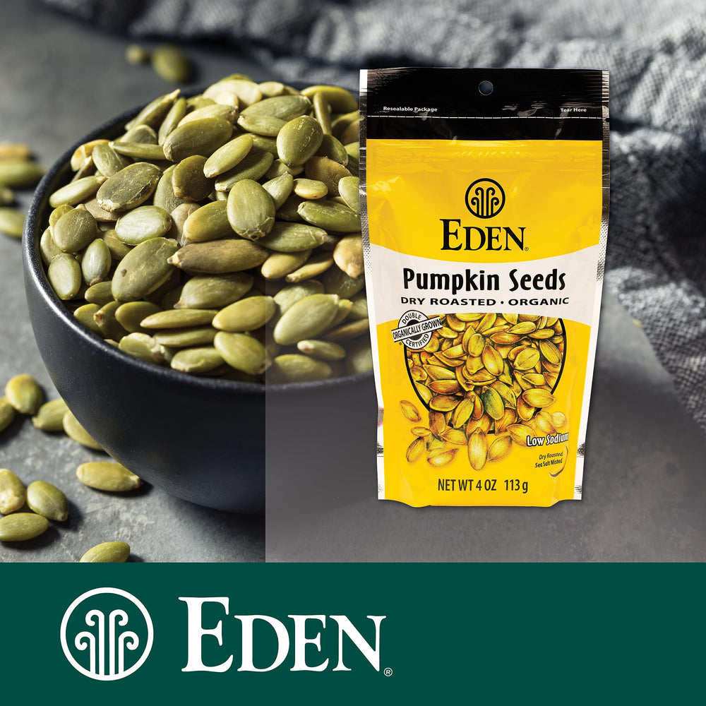 Eden pumpkin seeds closeup with salt flecks, tasty crunch.