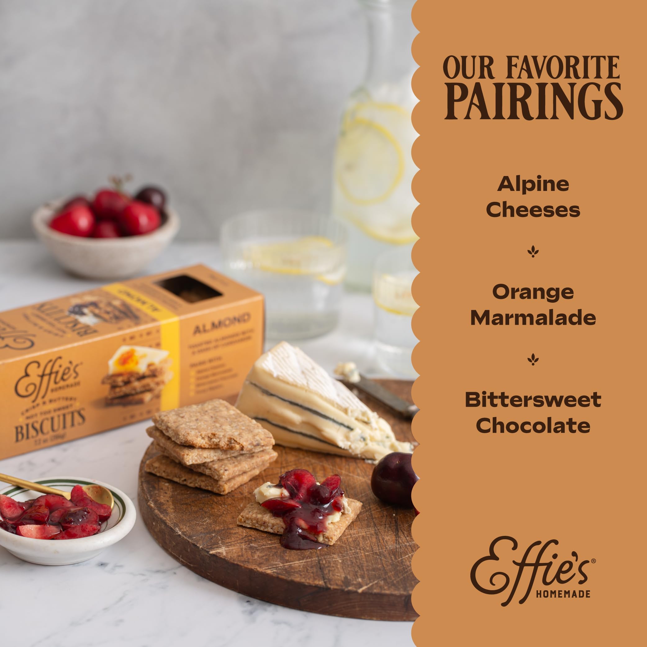 Effie's Almond biscuits beside chocolate and cheese platter for pairing.