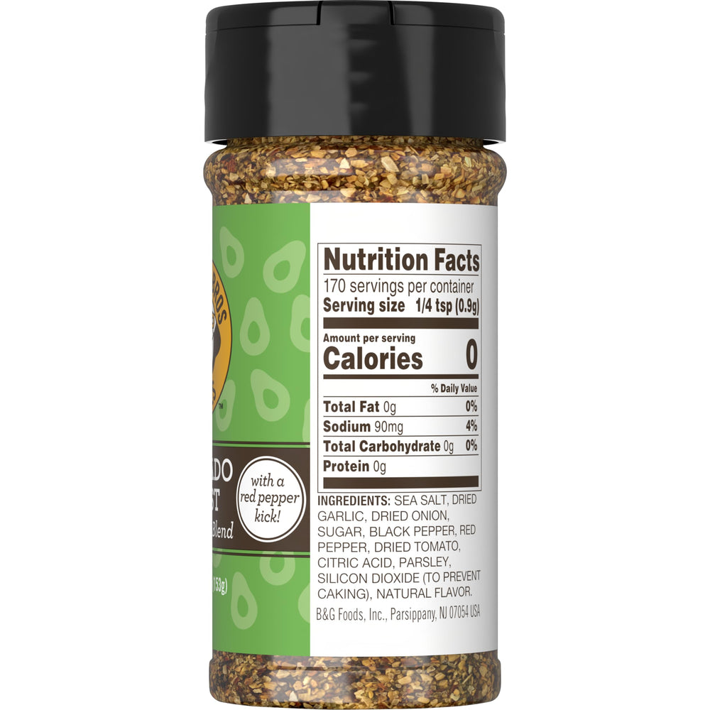 Close-up pour of Einstein Bros seasoning adding a zesty kick to avocado toast.