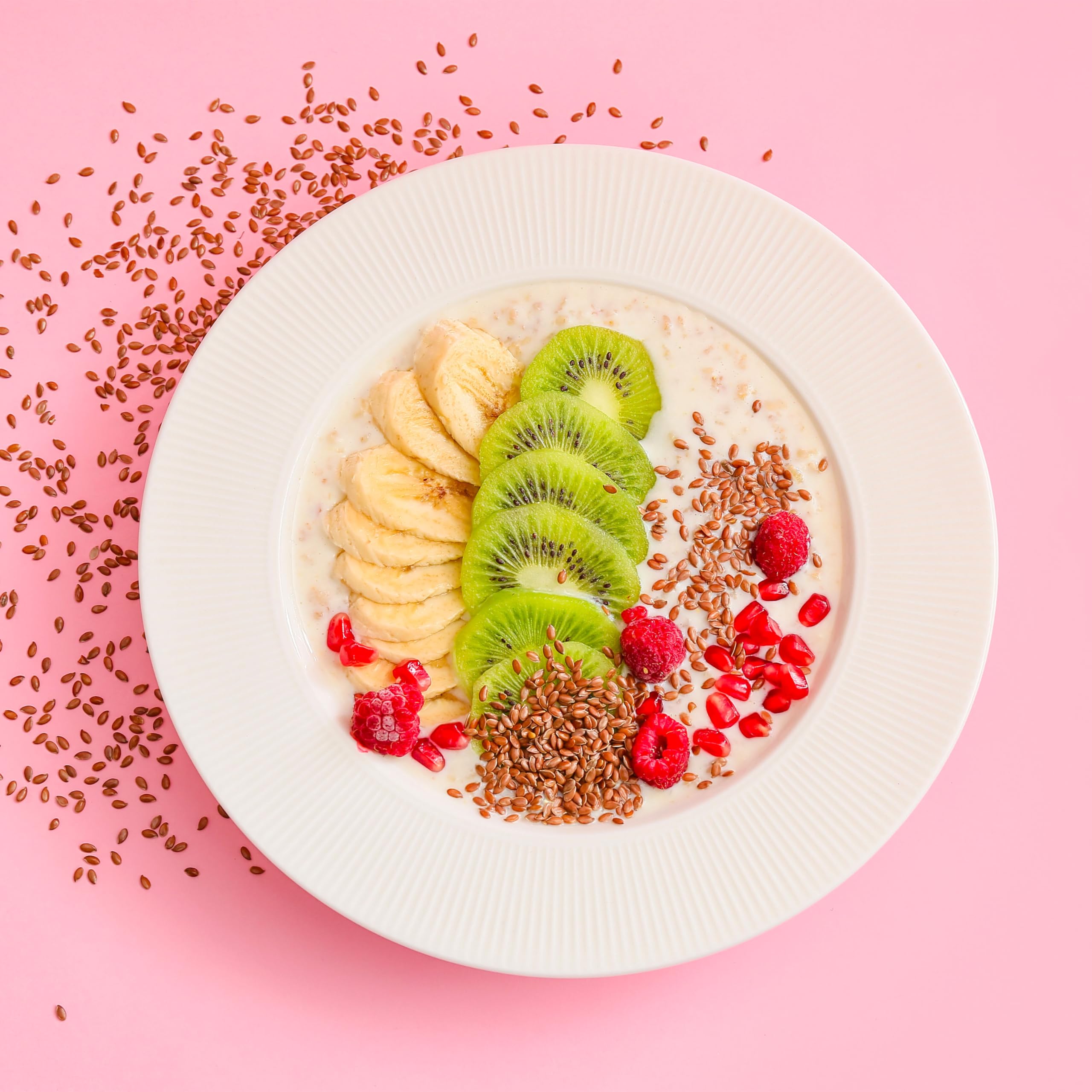 Elan Organic Flax Seeds in bowl emphasizes fiber-rich texture for breakfast bowls.