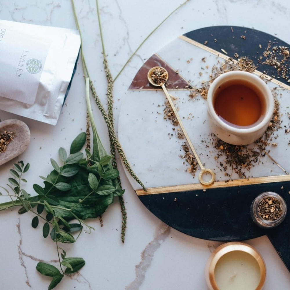 Elanen Naturals Breathe Tea cup steaming reveals inviting amber infusion.