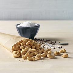 Emerald Salt and Pepper Cashews held in hand