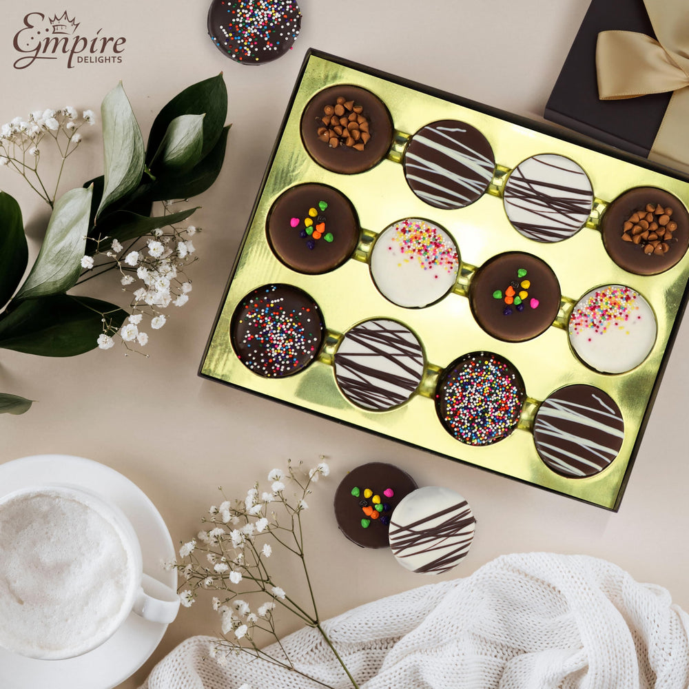 Empire Delights chocolate-covered cookies with toppings offer a decadent treat and vibrant detail.