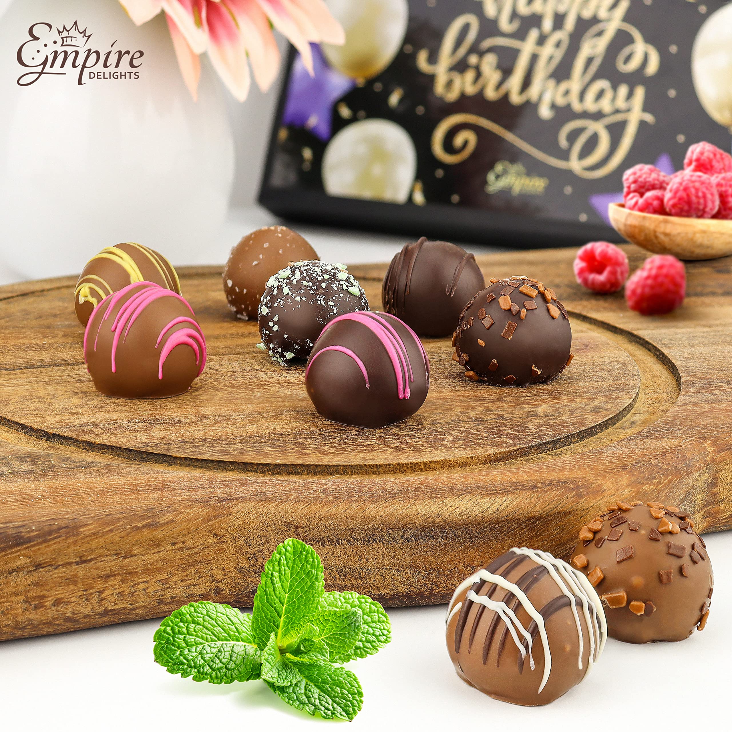 Raspberry truffle detail from Empire Delights, a fruity center in silky chocolate.