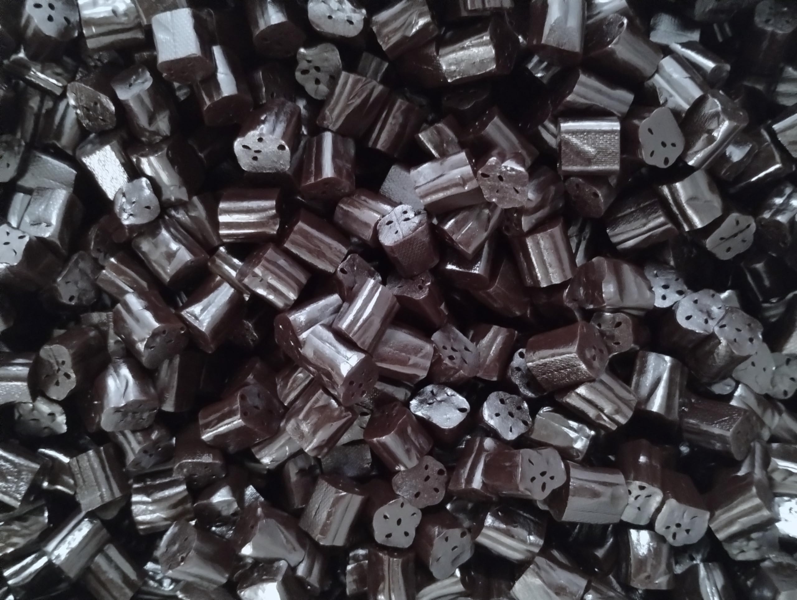 Bag of Emporium Candy black licorice bites shown for sharing