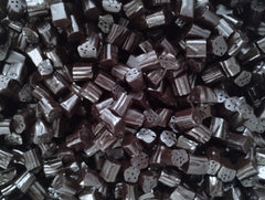 Bag of Emporium Candy black licorice bites shown for sharing