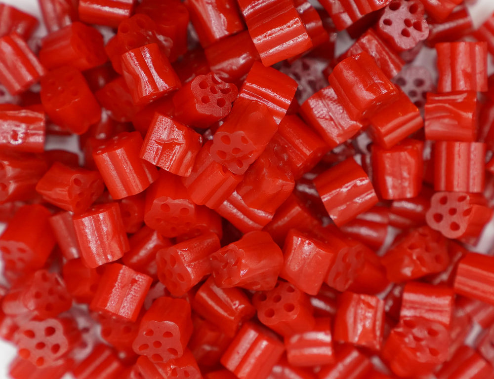 Emporium Candy Cherry Licorice Bites single piece highlighting the soft chewy center.