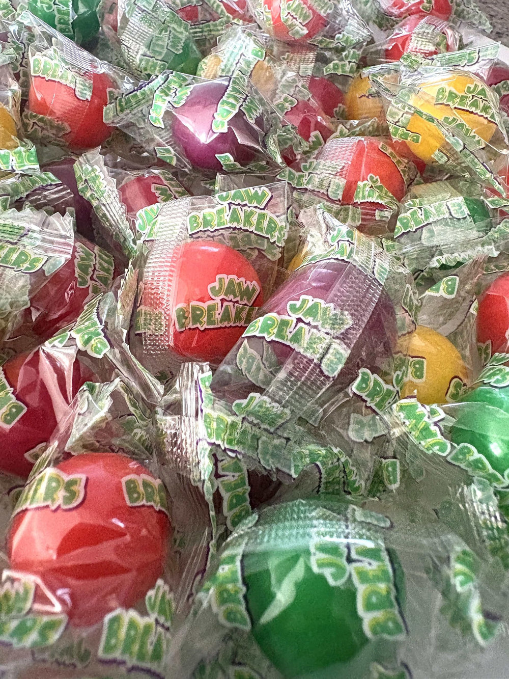 Emporium Candy colorful jaw breakers provide a playful snack option for kids.