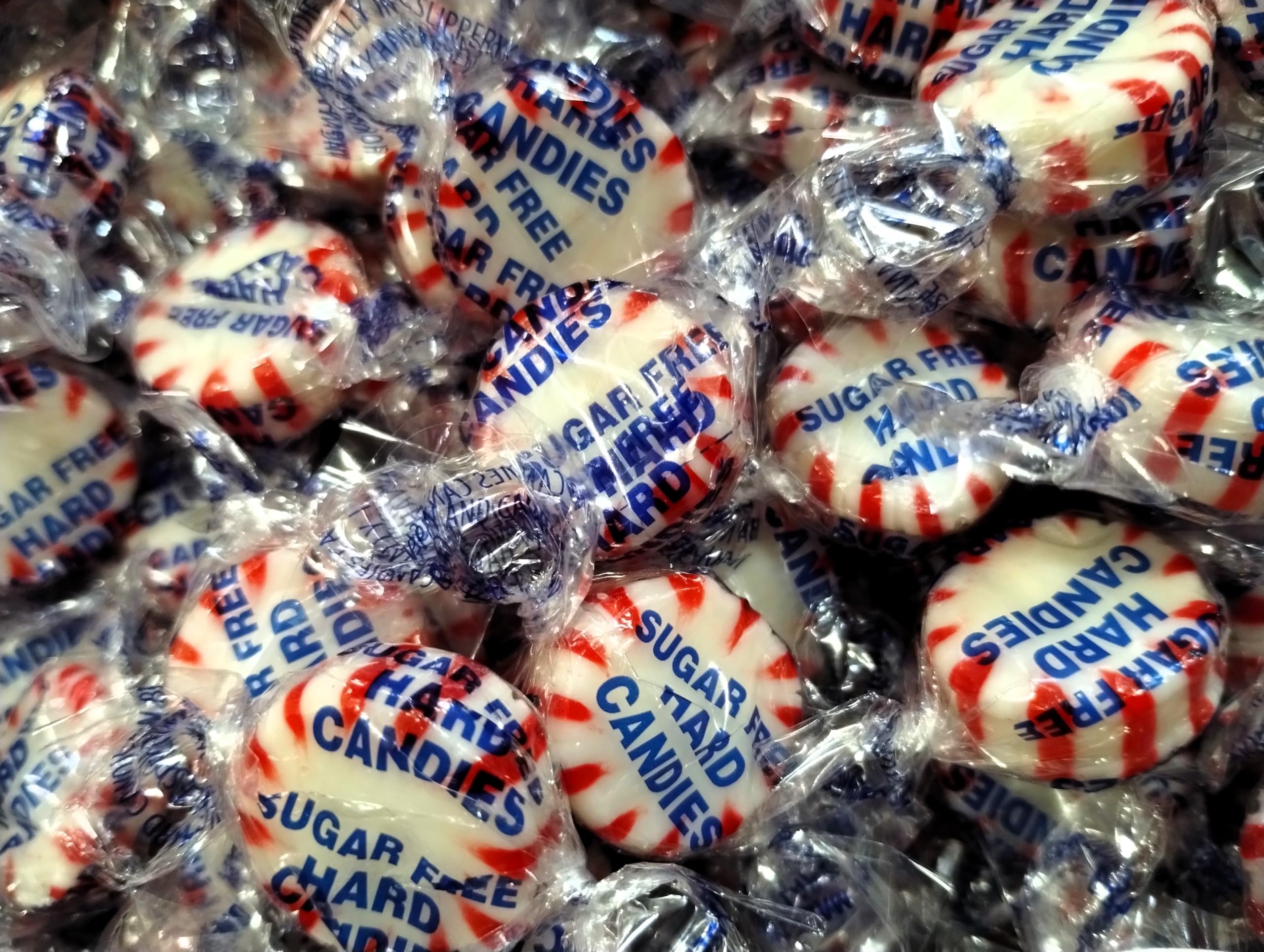Foil-wrapped Emporium Candy Sugar-Free Peppermint Starlight Buttons, travel-friendly.