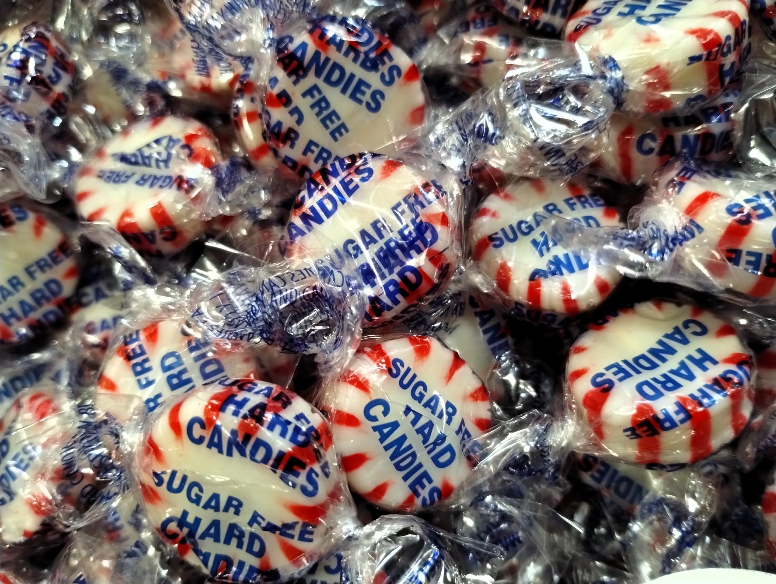 On-shelf display of Emporium Candy Sugar-Free Peppermint Starlight Buttons for minty treat.