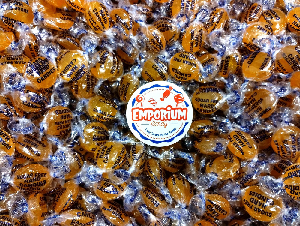 Emporium sugar-free butterscotch buttons close up showing smooth texture.