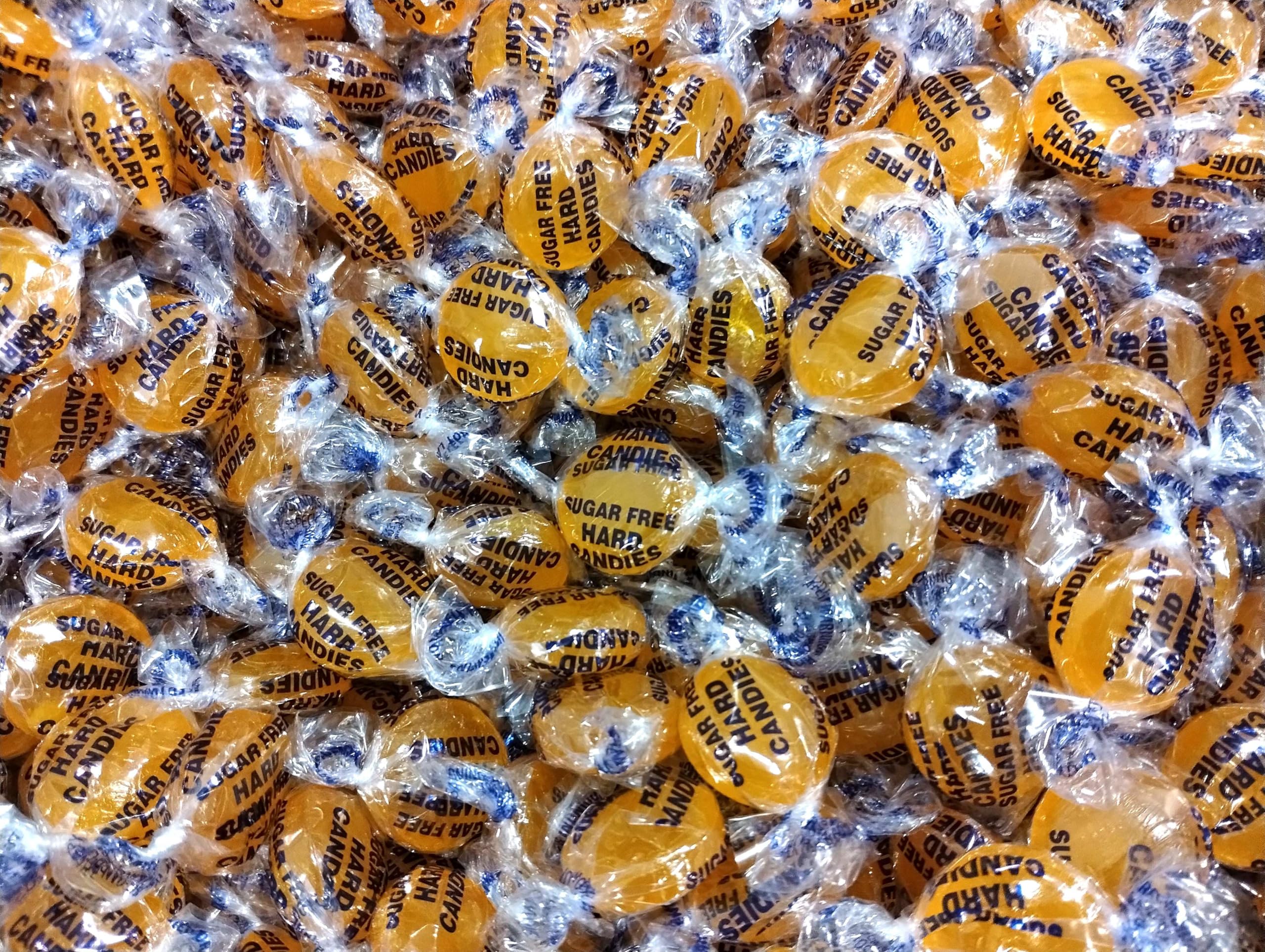 Emporium sugar-free butterscotch buttons refilling dispensers with clean packaging.