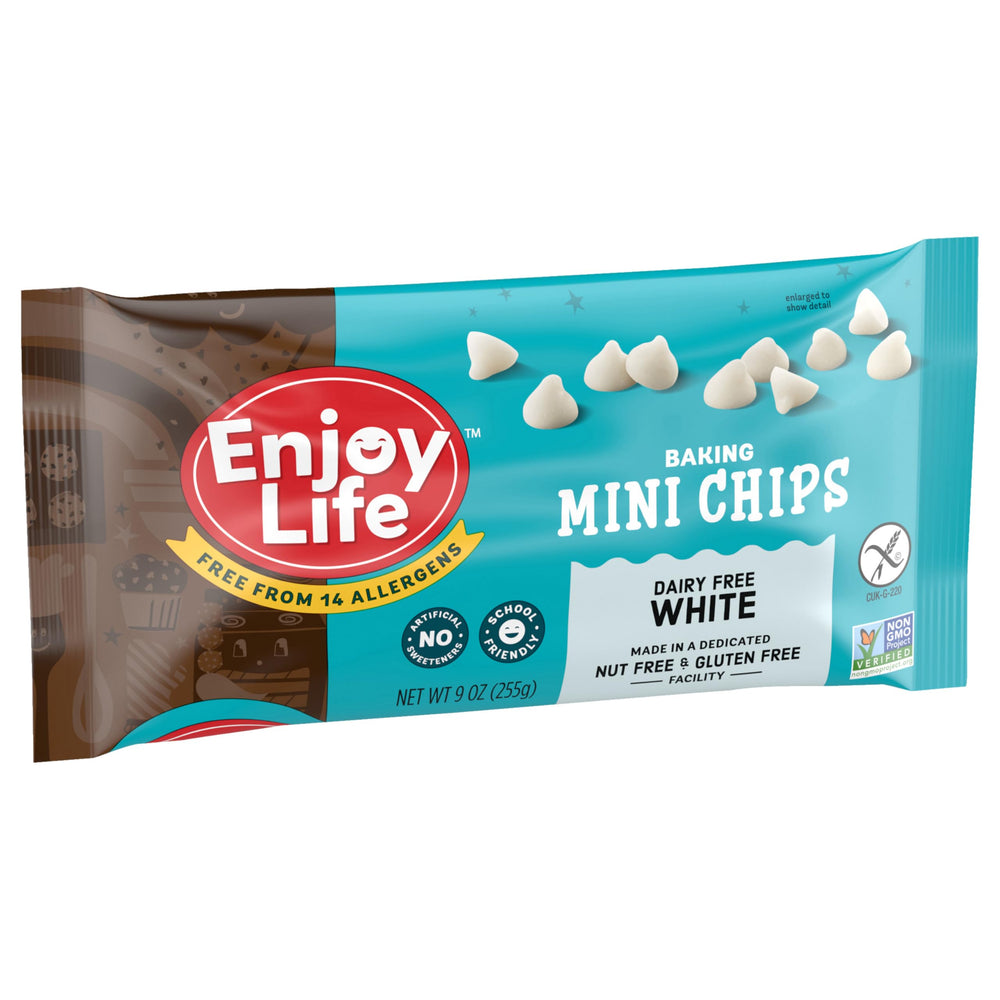 Baking setup with Enjoy Life White Mini Chips ready to fold into cookies.