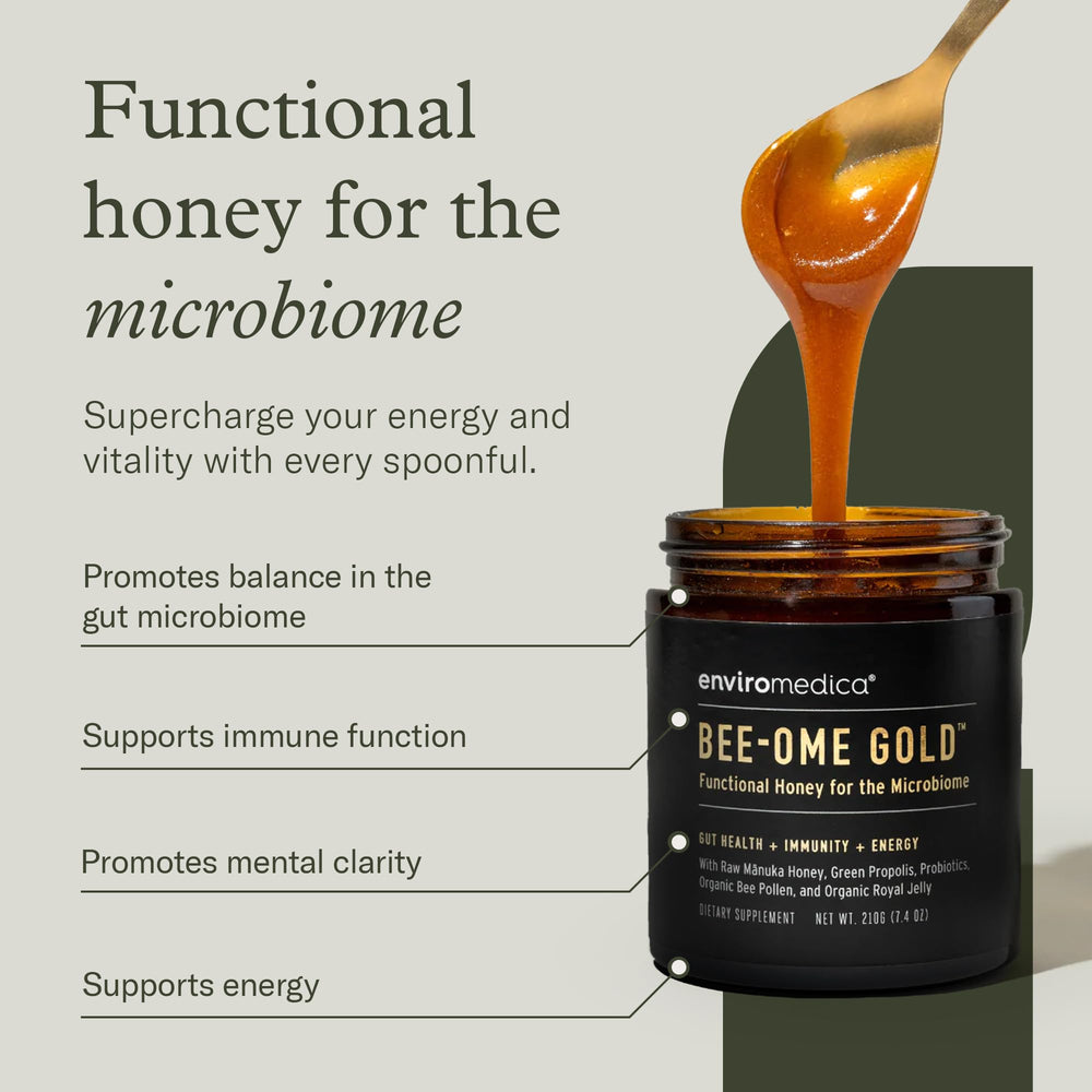 Bee-Ome Gold spoon-dip demonstrates probiotic-rich honey for a gut-friendly daily ritual