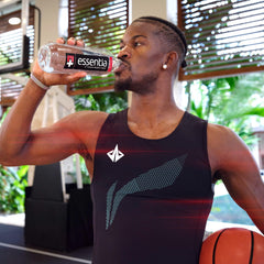 Pouring Essentia Water 1L bottle for a refreshing, smooth-tasting sip.
