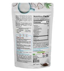 Pouring Essenzefruits coconut milk powder into a glass for dairy-free beverages