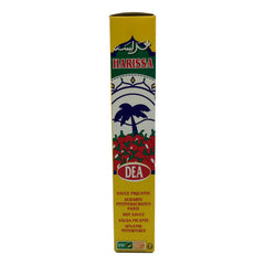 ETTO Harissa tube pouring bright, aromatic sauce over food.