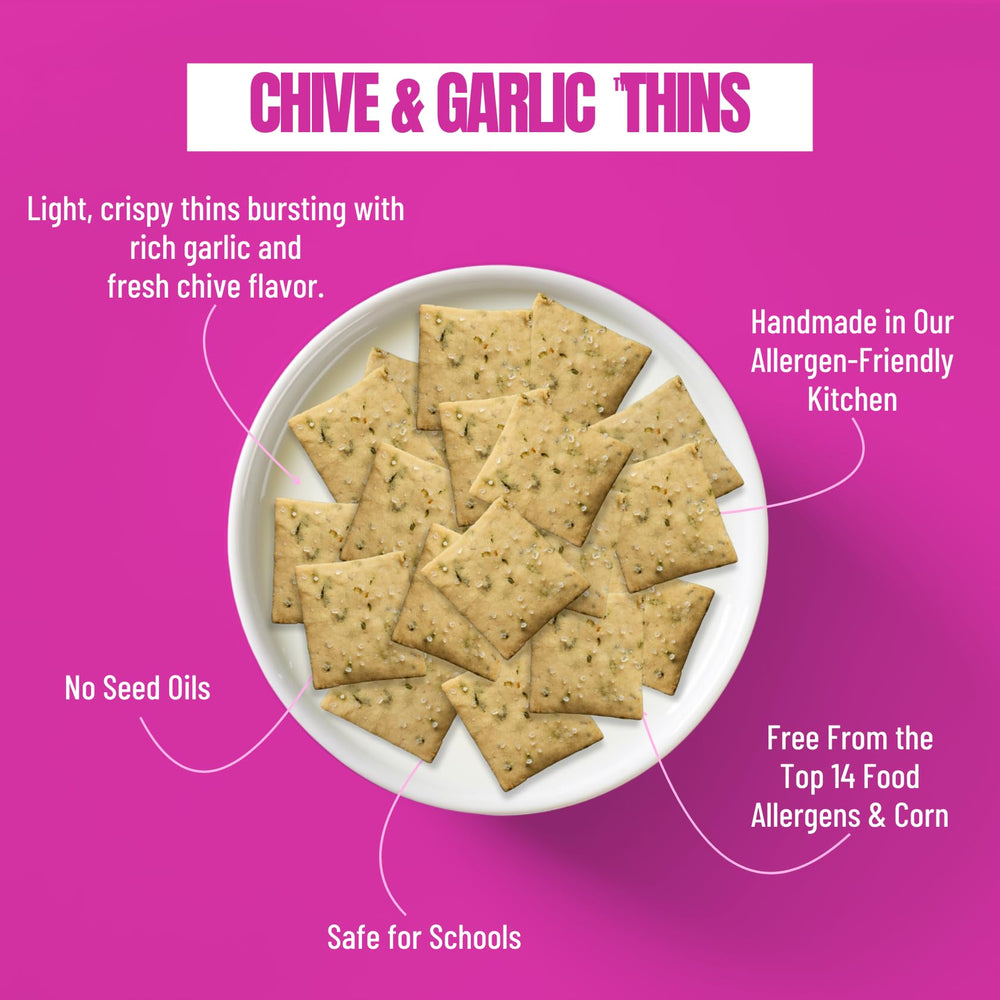 Every Body Eat Snack Thins Chive & Garlic in a lunchbox, school-safe and allergen-friendly.