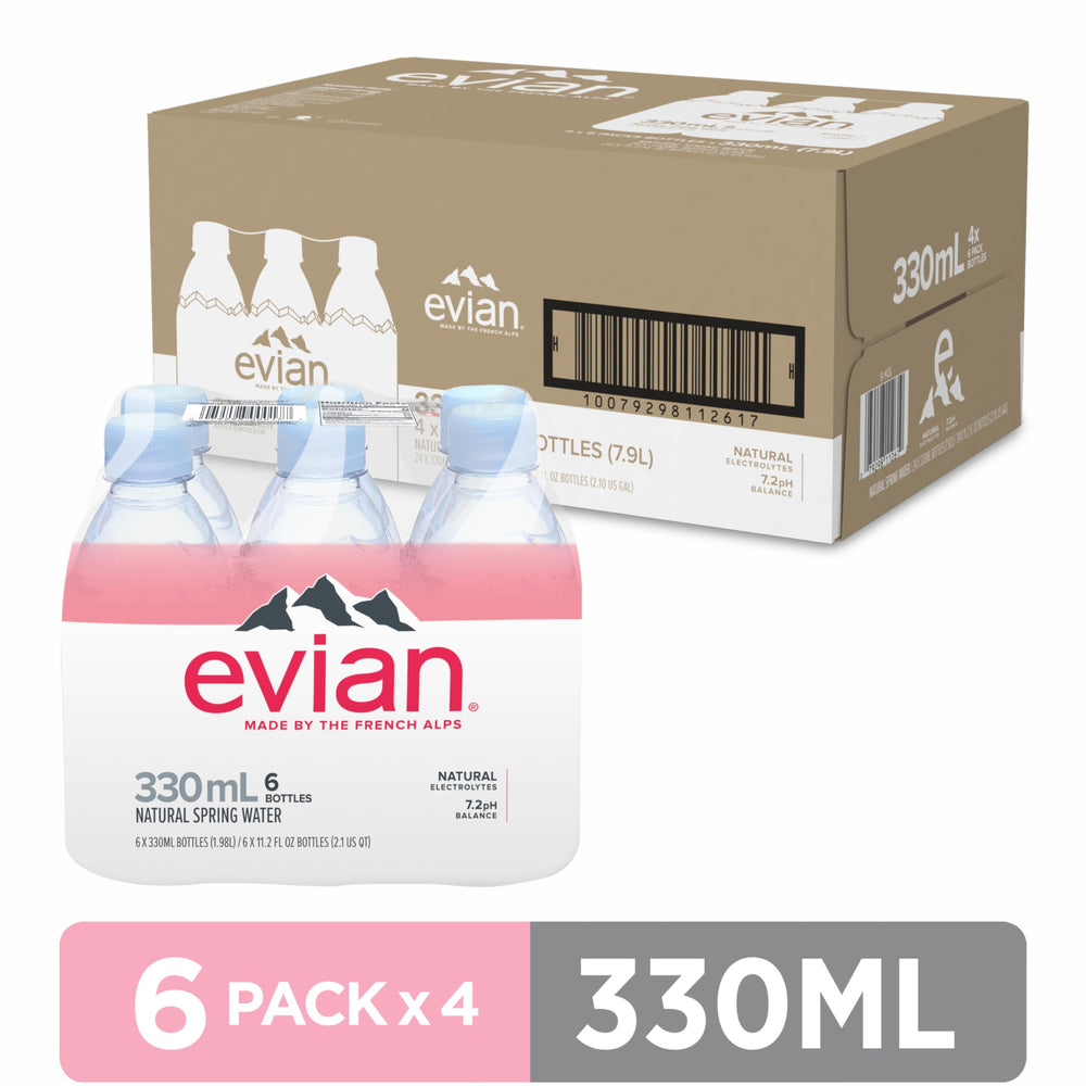 Evian bottle poured into glass, crisp taste for moments of refreshment.