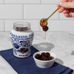 Fabbri Amarena wild cherries atop ice cream with glossy syrup.