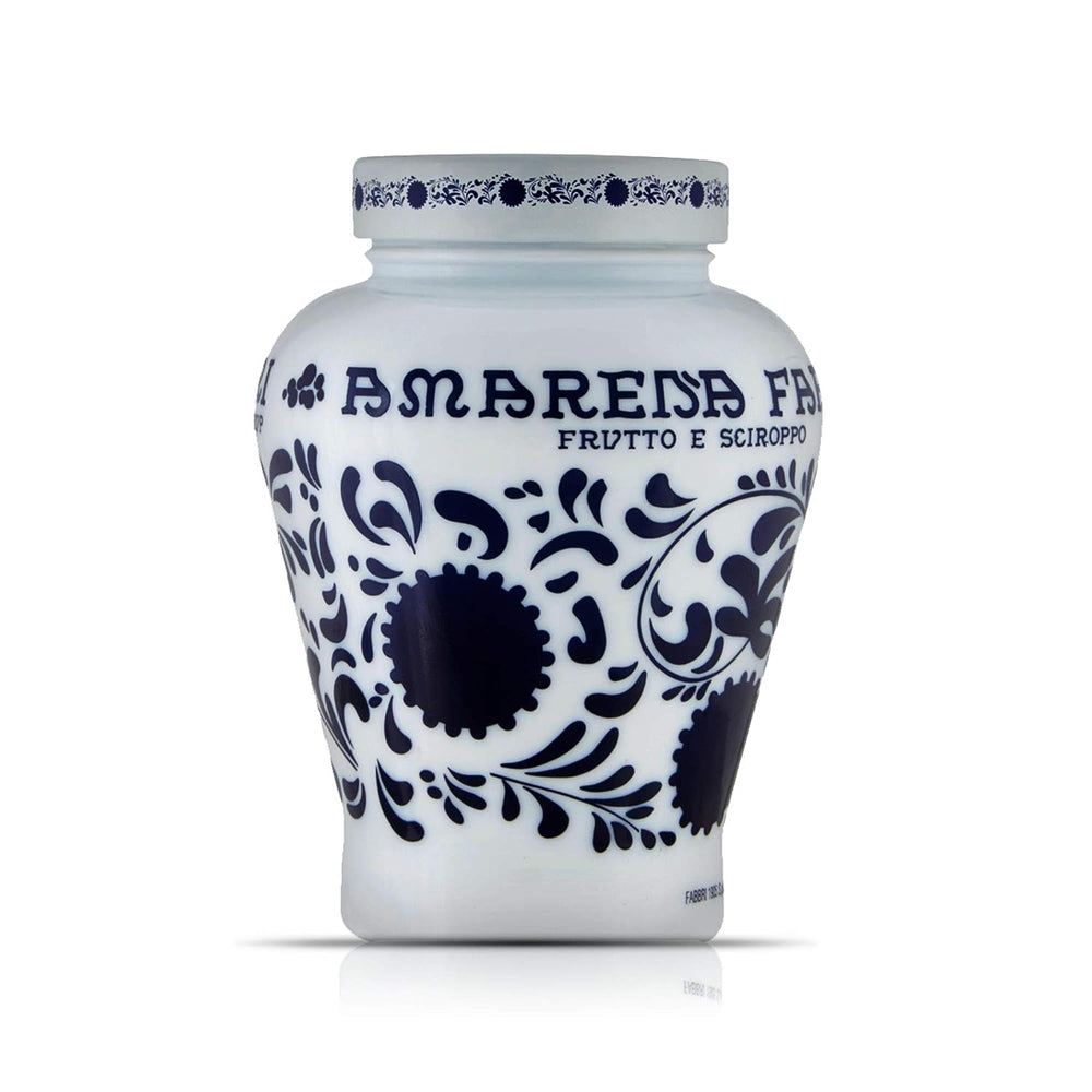 Fabbri Amarena wild cherries in syrup jar on shelf for versatile dessert topping.