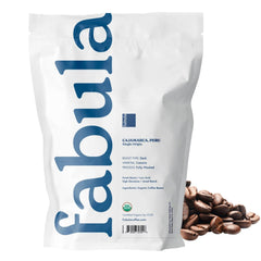 Steaming cup of Fabula Dark Roast emphasizing smooth finish and low acidity.