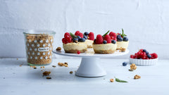 Serving bowl with muesli, milk and berries for breakfast.