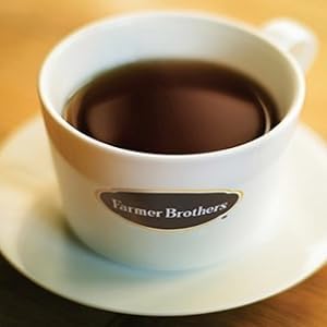 Brewing setup showing simple filter and cup with Farmer Brothers coffee