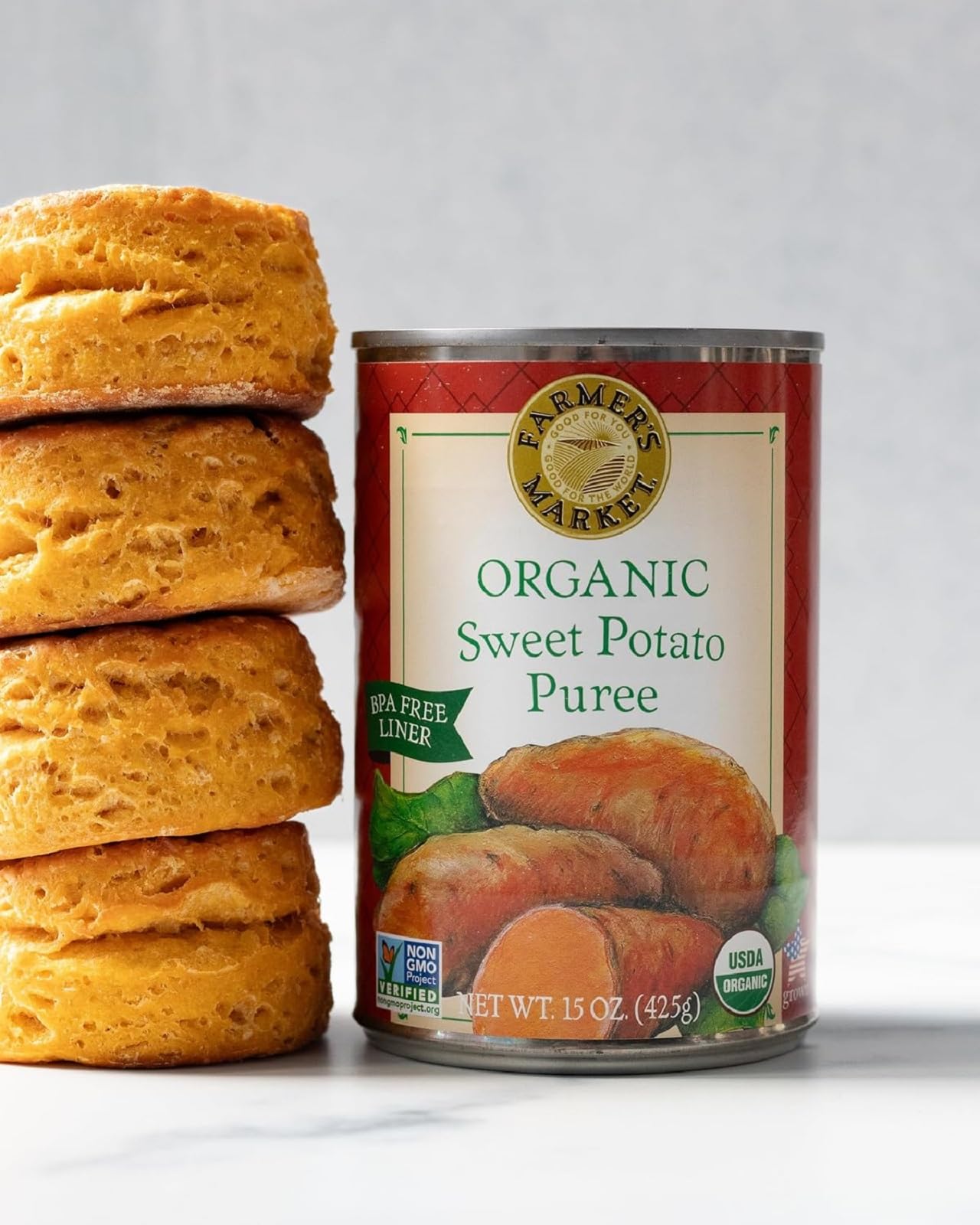 FARMER'S MARKET Organic Sweet Potato Puree beside a steaming bowl for sauces