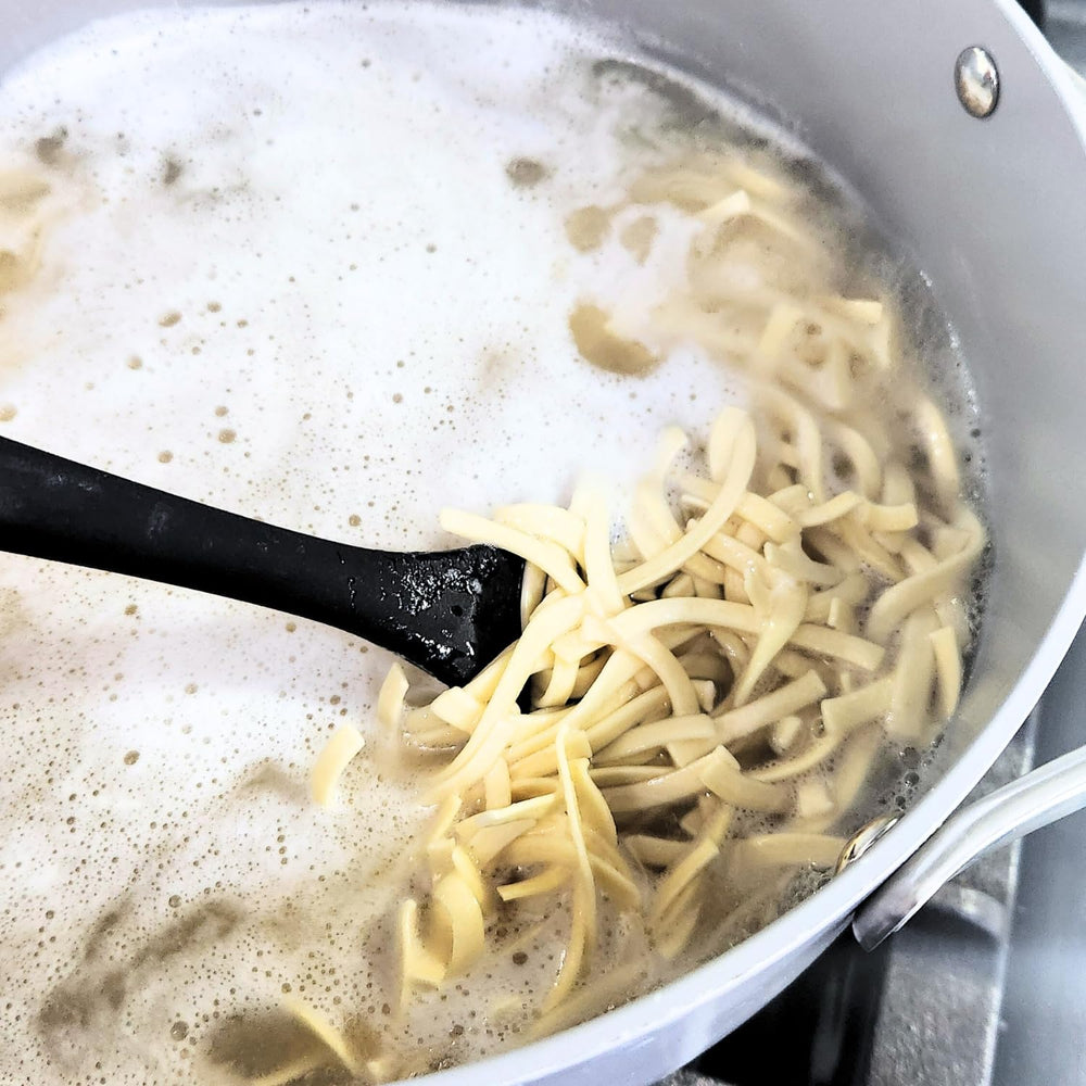 Farmhouse Preserve noodles in chicken soup, versatile for comforting bowls.