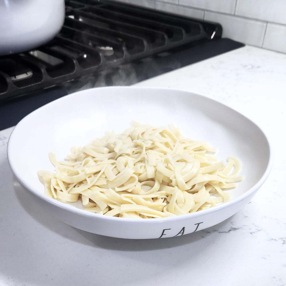 Farmhouse Preserve sheet-cut noodles during rolling, showcasing old-world craftsmanship.