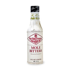Fee Brothers Mole Bitters bottle close-up highlighting cacao-based depth for cocktails.