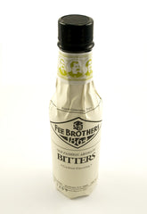 Fee Brothers Old Fashion Aromatic Bitters bottle highlighting citrus oils for classic cocktails