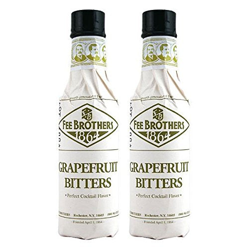 Fee Brothers Grapefruit Cocktail Bitters bottle on a bar shelf to brighten citrus cocktails.