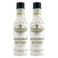 Fee Brothers Grapefruit Cocktail Bitters bottle on a bar shelf to brighten citrus cocktails.