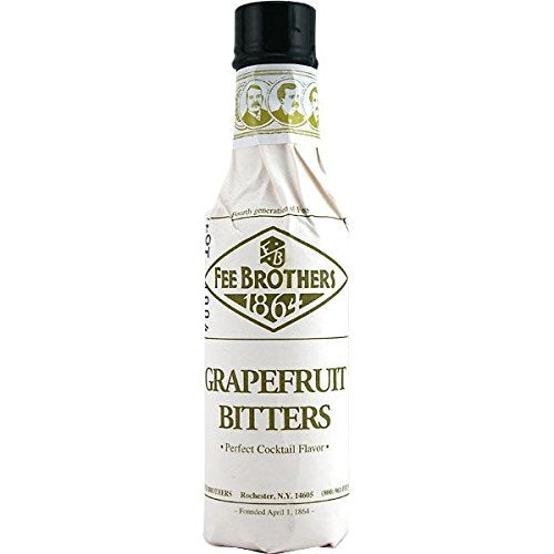 Fee Brothers Grapefruit Cocktail Bitters being poured into a glass to balance citrus flavors.