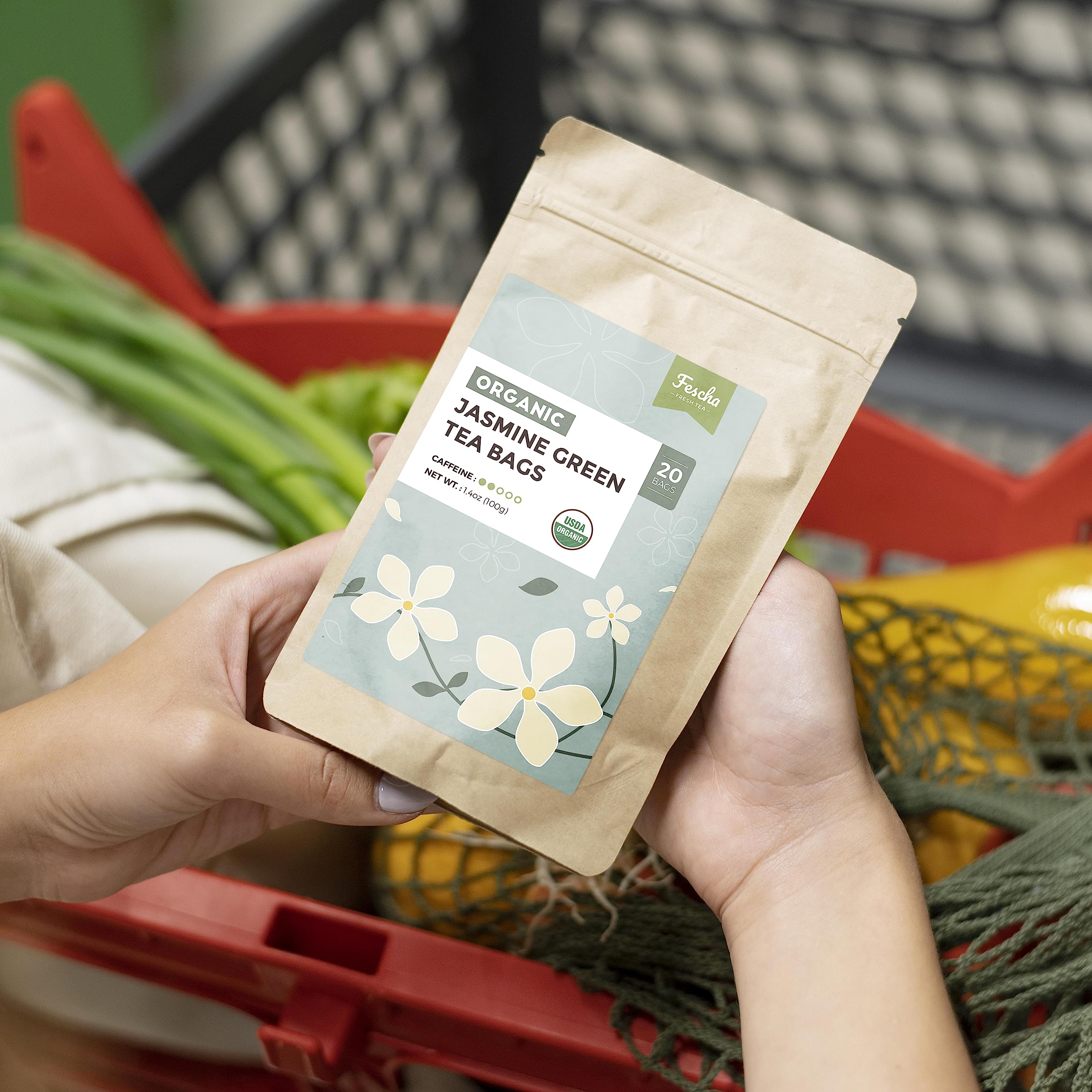 Fescha jasmine-green-tea packaging shows resealable kraft bag preserving freshness