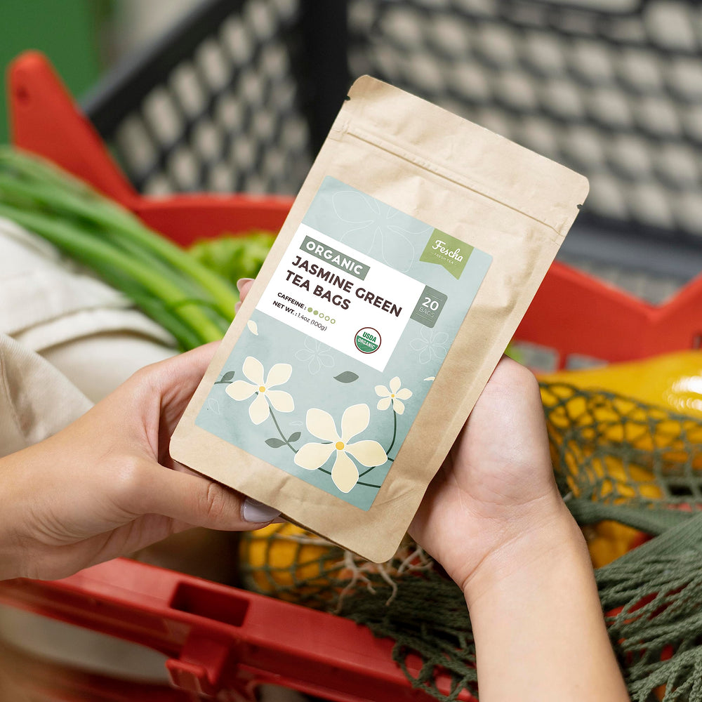 Fescha jasmine-green-tea packaging shows resealable kraft bag preserving freshness